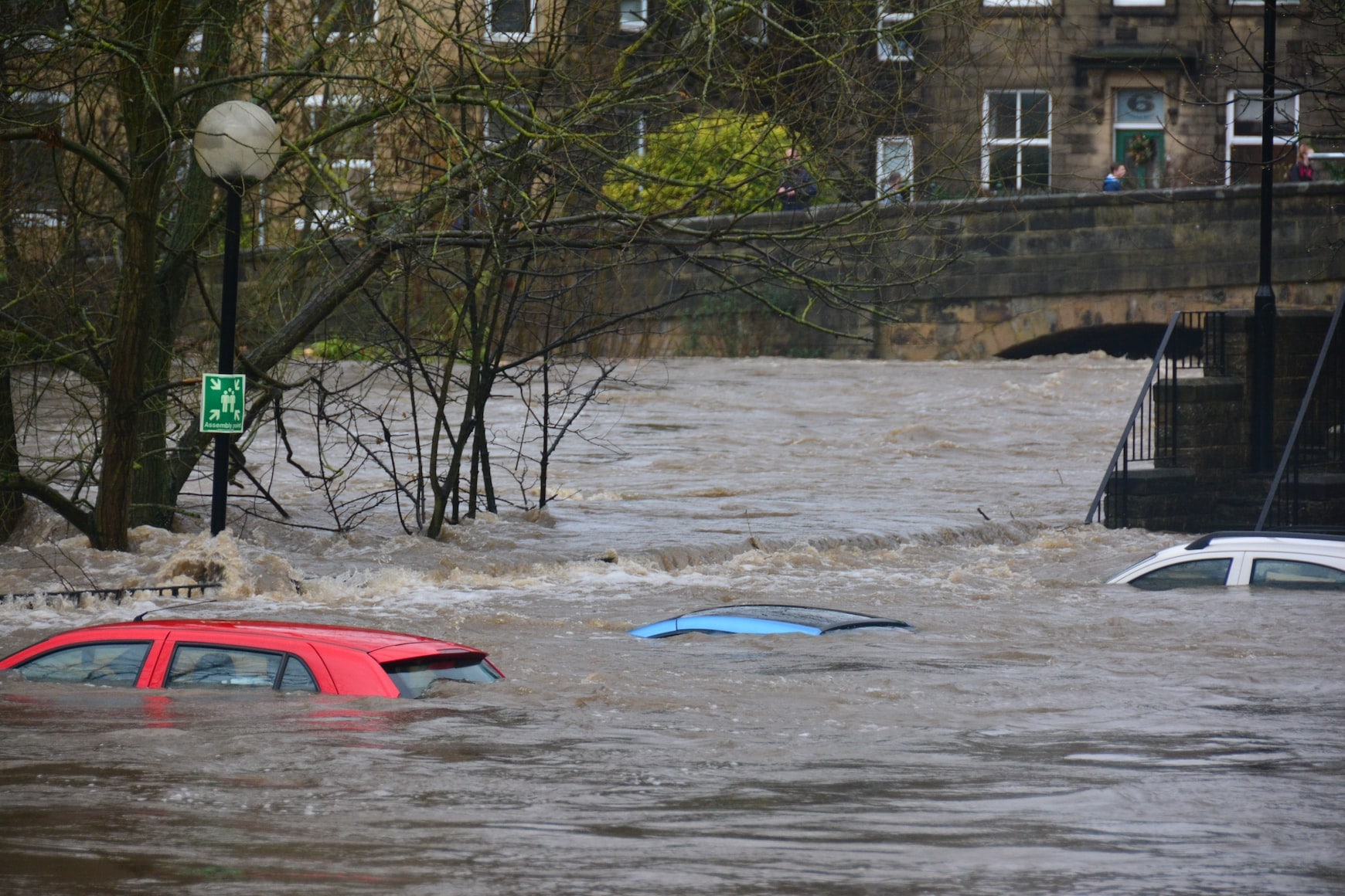 Cars on the street submerged in flood 
